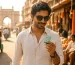 Mouth freshener in summer India – young professional using Mountain Breeze breath strips on a hot day