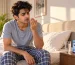 Young Indian adult waking with dry mouth and bad breath after sleeping with mouth open